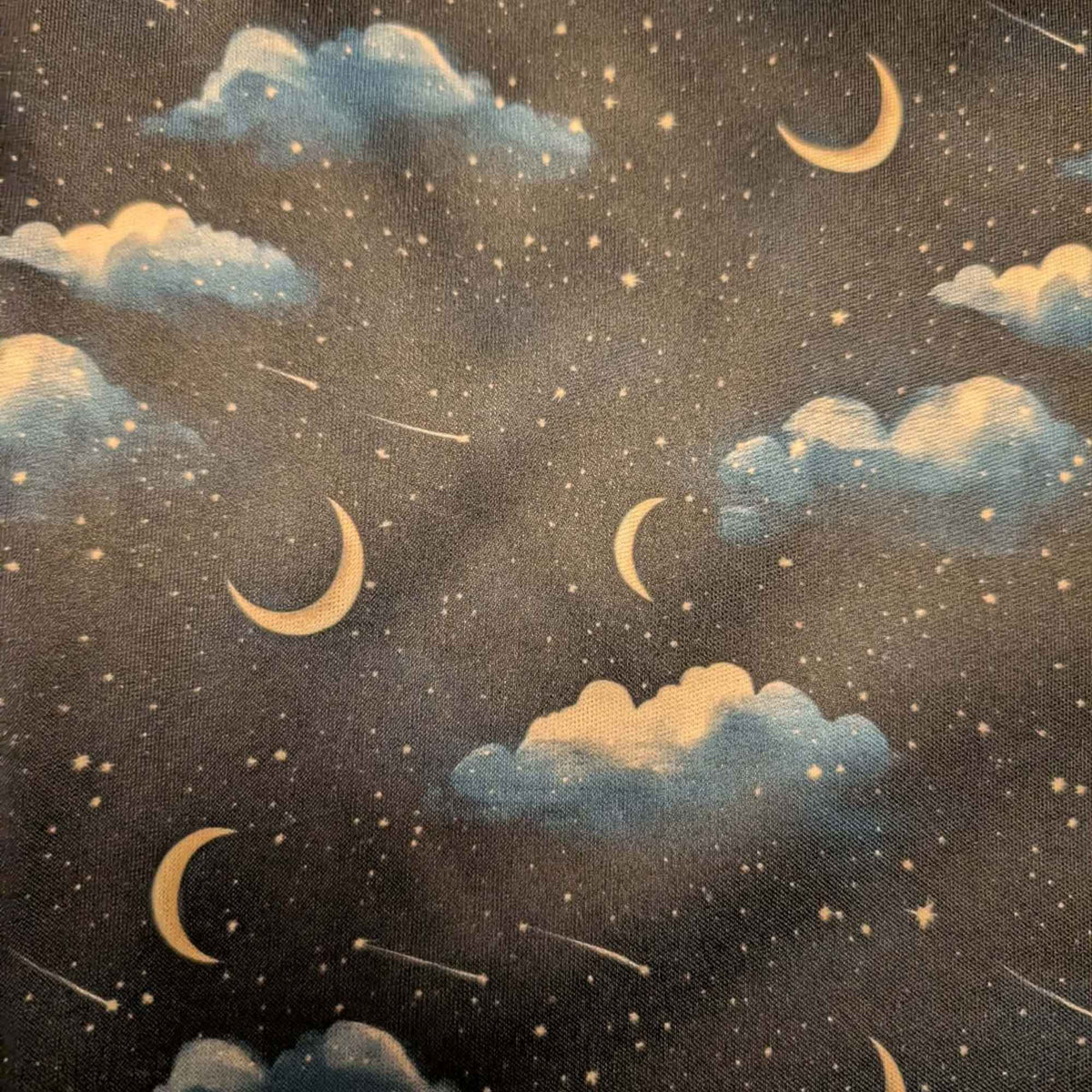 Moonlit Clouds and Shooting Stars exclusive waterproof PUL fabric with golden crescent moons, blue clouds and stars on black