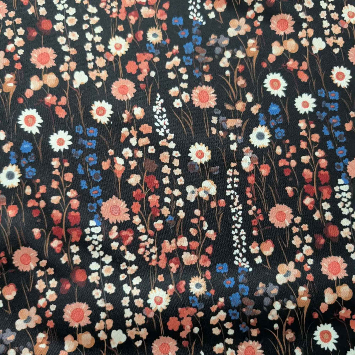 Vintage Wildflower Meadow exclusive waterproof PUL fabric with coral, cream and blue flowers on a black background