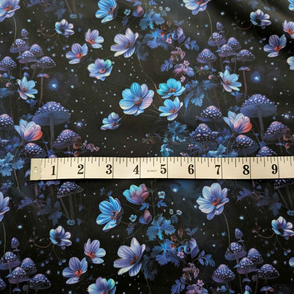 Enchanted Midnight Mushroom Garden exclusive waterproof PUL fabric with glowing blue flowers, spotted mushrooms and stars on black
