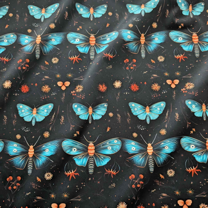 Midnight Blue Moths and Wildflowers exclusive waterproof PUL fabric with turquoise moths and orange flowers on a black background