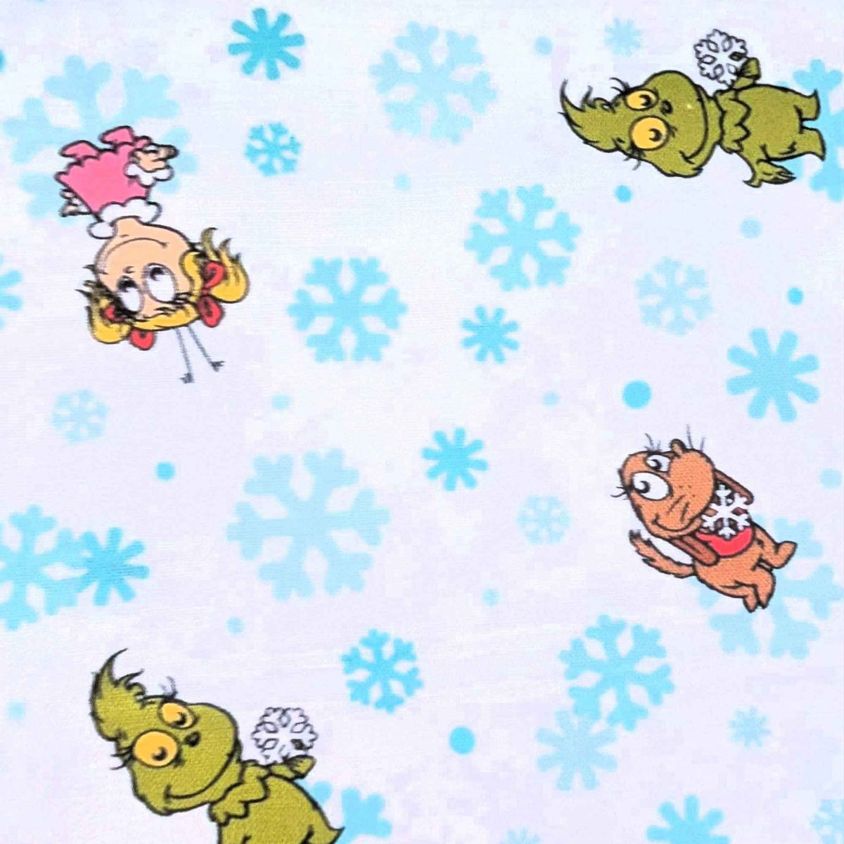 Little Grinch cotton fabric with Grinch characters and aqua snowflakes on white