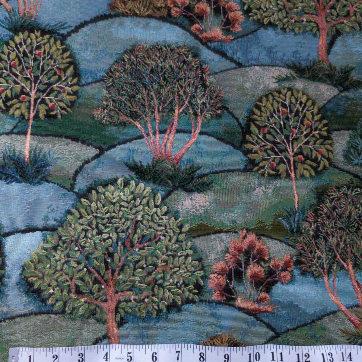 Forest Hill Woodland Trees Gobelin tapestry fabric with leafy trees, muted pink branches and rolling blue and sage green hills.