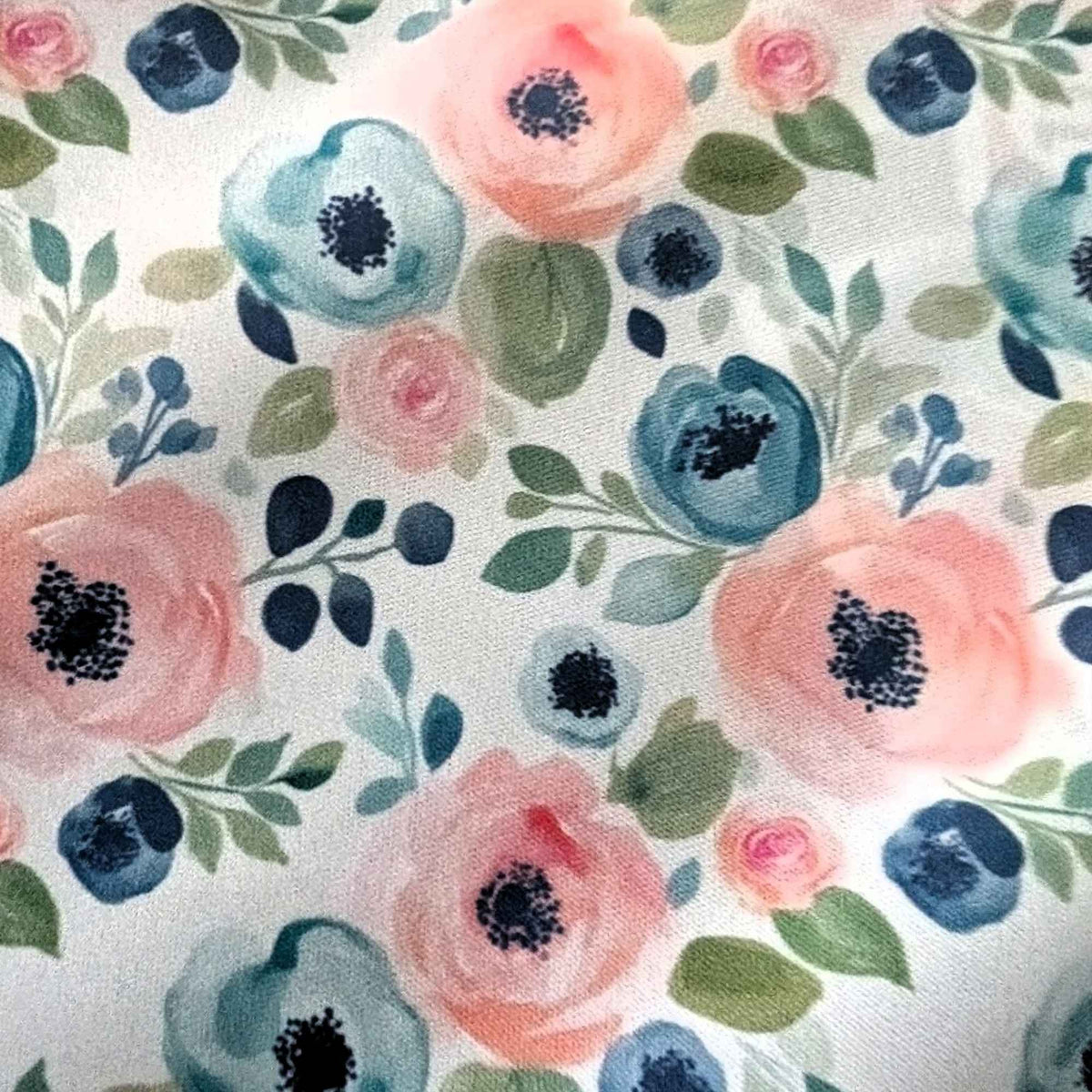 Blush and Blue Watercolour Blooms exclusive waterproof PUL fabric with pink and blue flowers and green leaves on teal