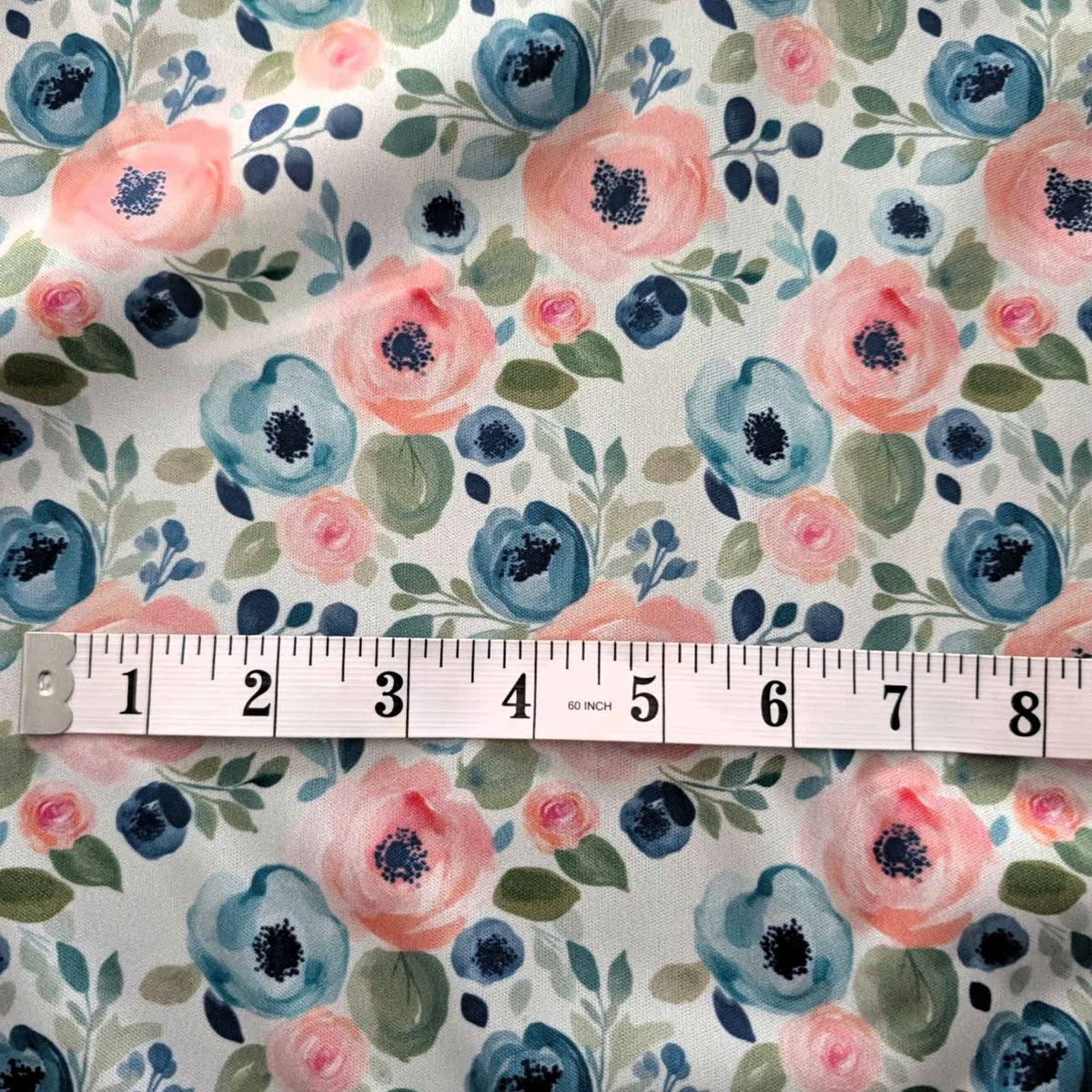 Blush and Blue Watercolour Blooms exclusive waterproof PUL fabric with pink and blue flowers and green leaves on teal