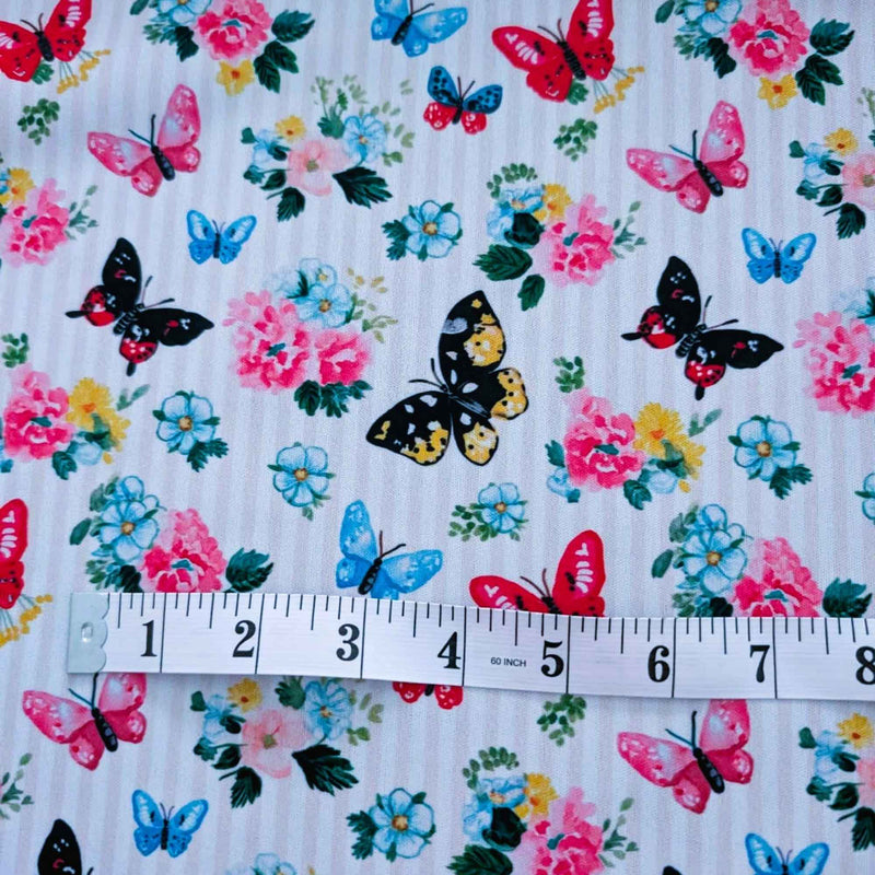 Colourful Butterfly Garden exclusive waterproof PUL fabric with blue, pink, red and yellow butterflies and flowers on yellow stripes