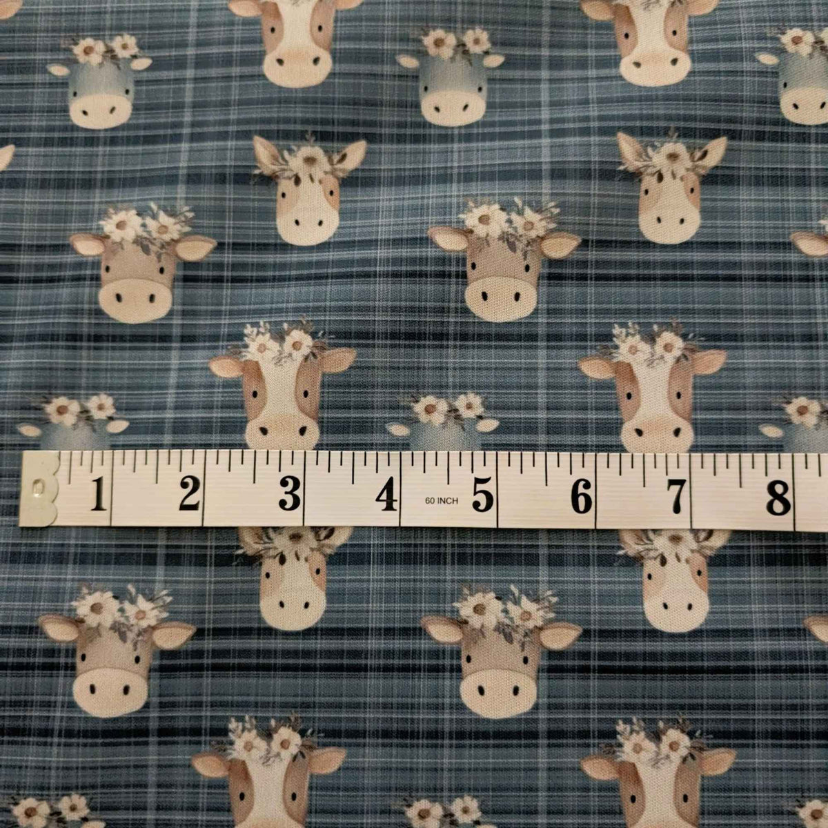 Flower Crown Cows on Blue Plaid exclusive waterproof PUL fabric with brown and grey cows wearing white flowers