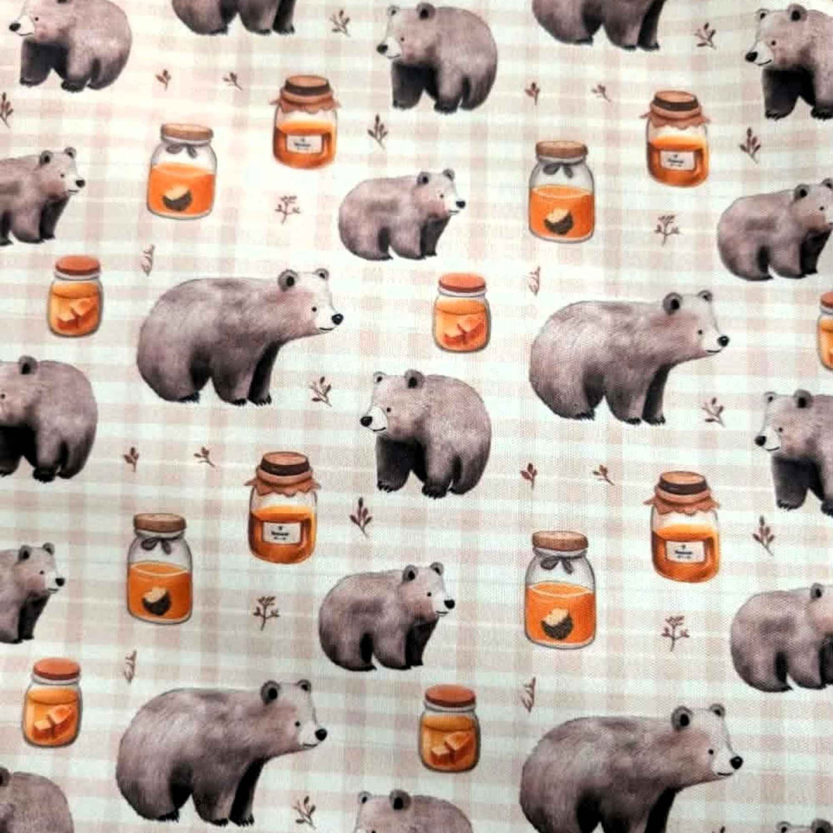 Honey Bear exclusive waterproof PUL fabric with brown bears, golden honey jars and botanical sprigs on a cream checked background