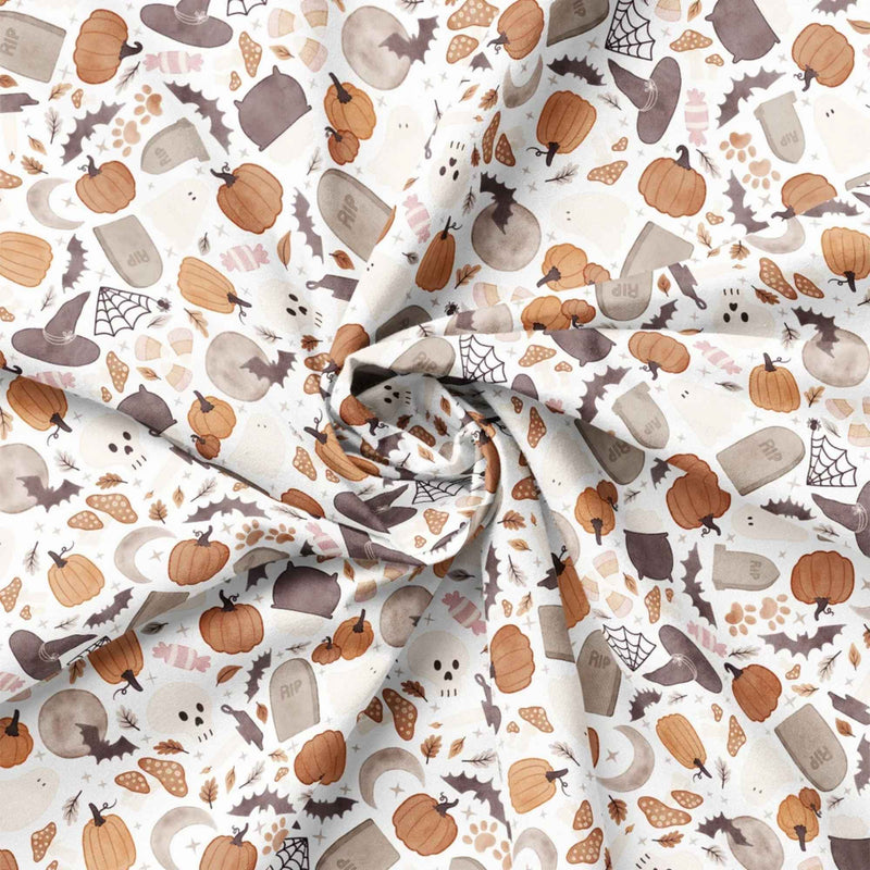 Pumpkins and Paws Halloween cotton fabric with ghosts, bats, pumpkins, paw prints and gravestones