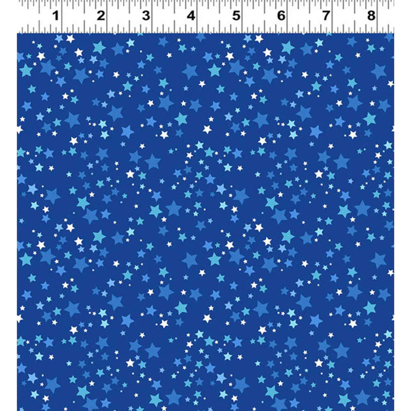 “Blue cotton fabric with scattered stars in multiple shades of blue and white.”