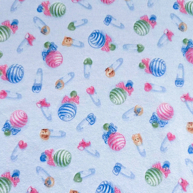 Baby Rattle and Safety Pins Flannel – Light Blue | 100% Cotton Nursery Fabric by Mai Designs