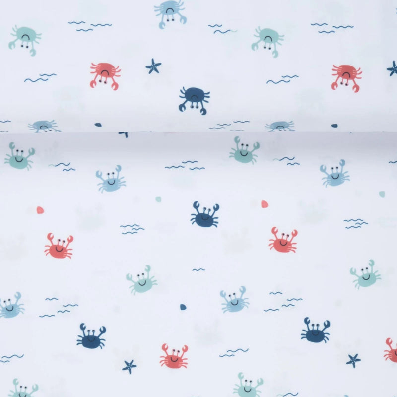 White swim fabric with playful red, blue, and mint crabs and beach motifs – Oeko-Tex certified stretch knit for kids' swimwear and ocean-themed projects