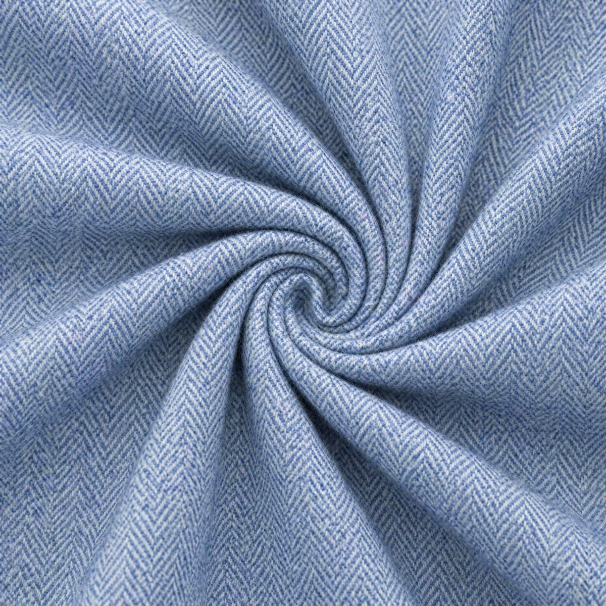 Close-up of blue fabric with a herringbone pattern