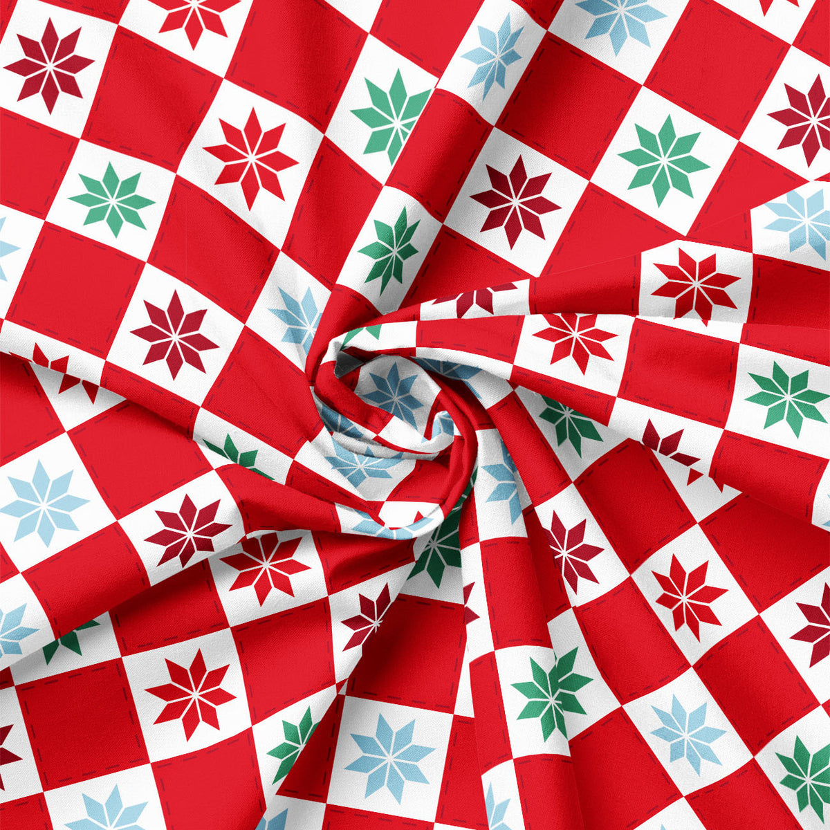 Close-up of patchwork snowflake block print showing fabric drape and scale