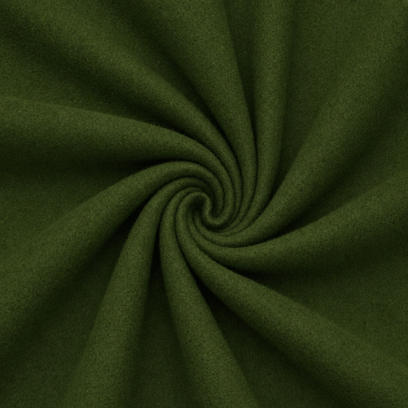 Close-up of dark green fabric with a swirl pattern