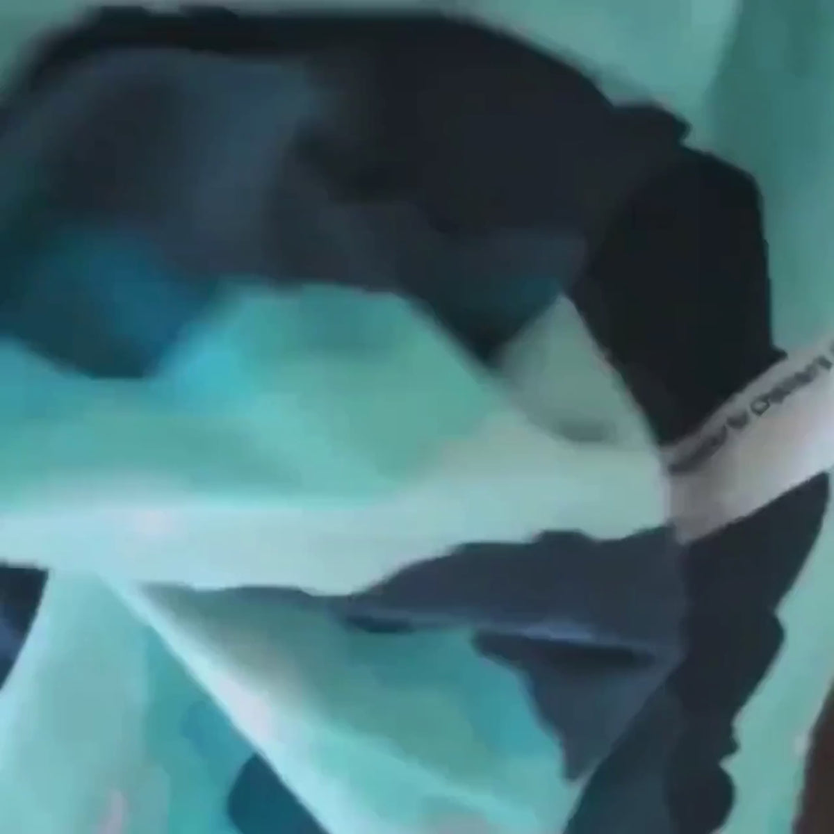 Video of Teal, navy and grey mountain print flannel fabric with pink crescent moons
