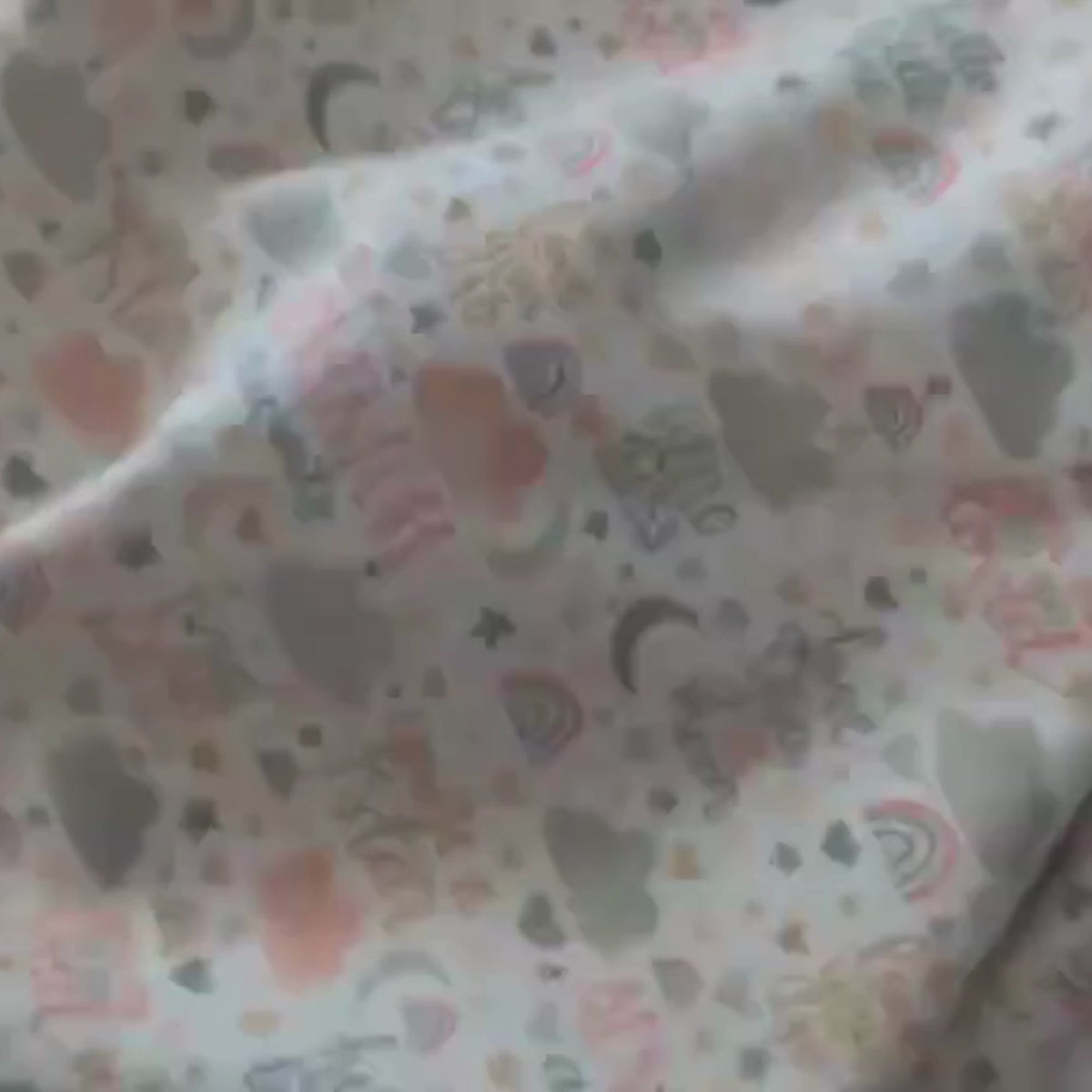 Video of Cotton flannel fabric with pastel baby phrases, stars, rainbows, clouds, and moons on white background – 44 inches wide, soft brushed cotton