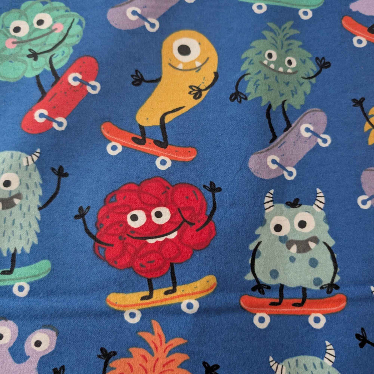 Skateboarding Monsters Cotton Flannel Fabric – Blue | Oeko - Tex Certified