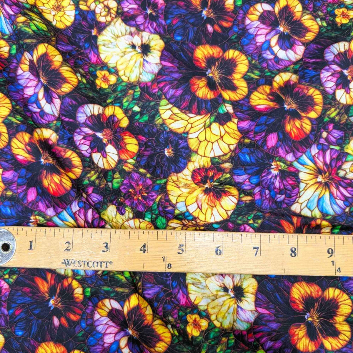 Stained glass-style pansy fabric with vibrant yellow, purple, and multicolored flowers – Gigi in the Garden 60-inch wide cotton quilt backing