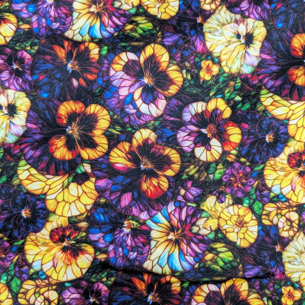 Stained glass-style pansy fabric with vibrant yellow, purple, and multicolored flowers – Gigi in the Garden 60-inch wide cotton quilt backing