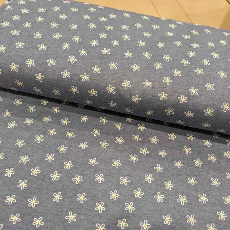 Daisy Flower FLANNEL Fabric on a Blue Denim Background