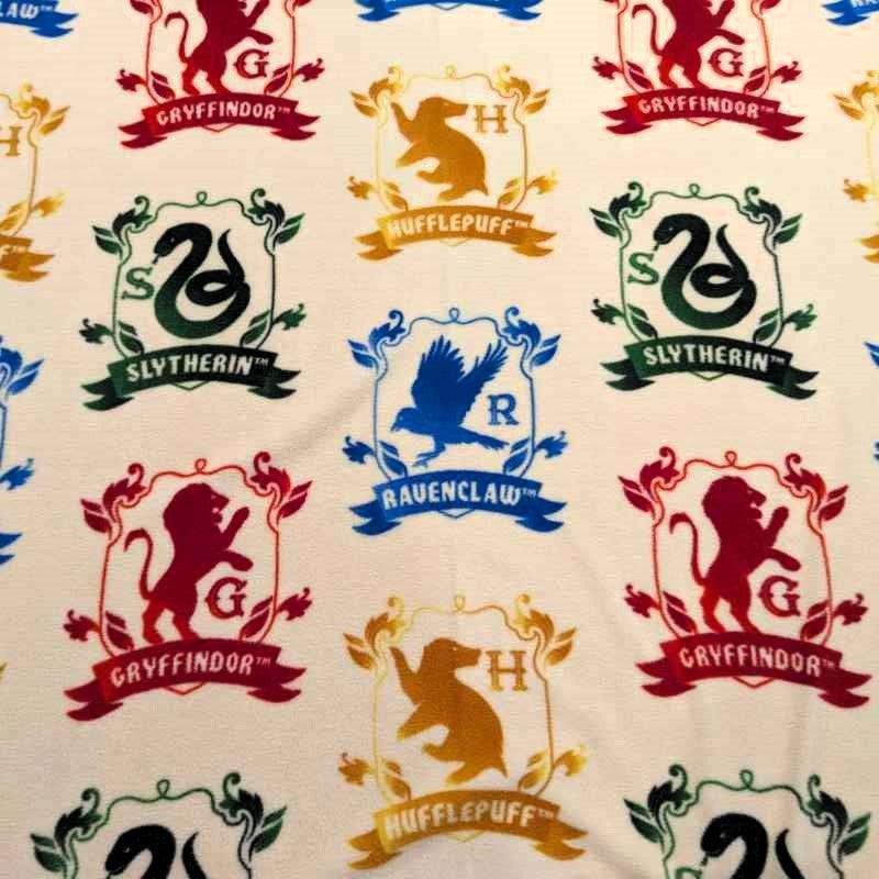 Harry Potter Anti-Pill Polar Fleece, Hogwart's Houses in Cream - Fabric Design Treasures