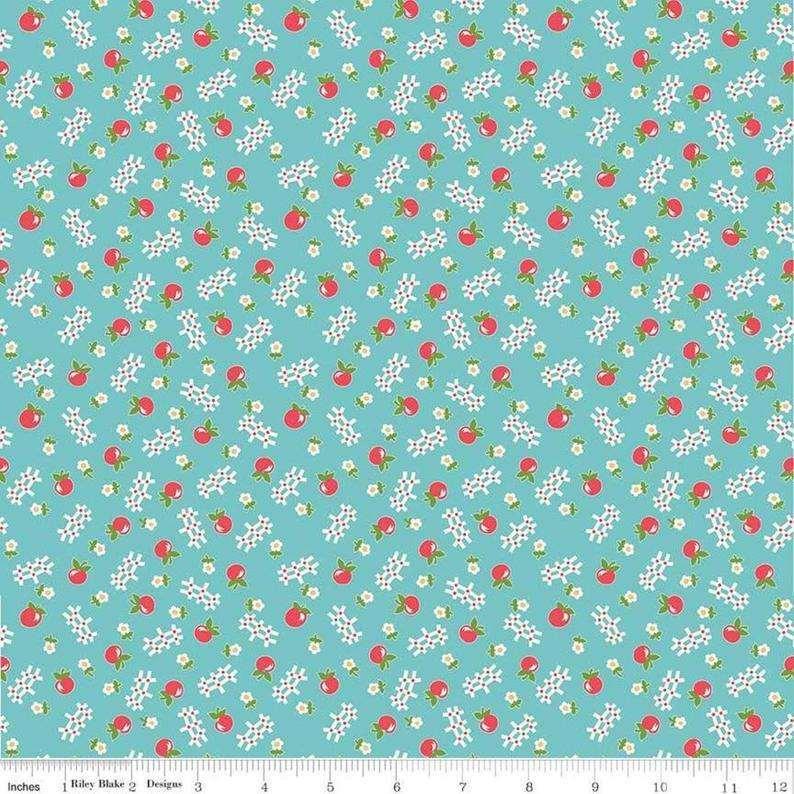 Little Apples Fabric on Teal Background