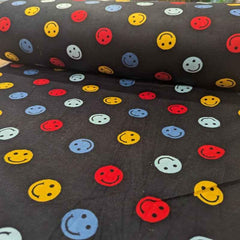 Multi colored Be Happy Face FLANNEL fabric on navy blue