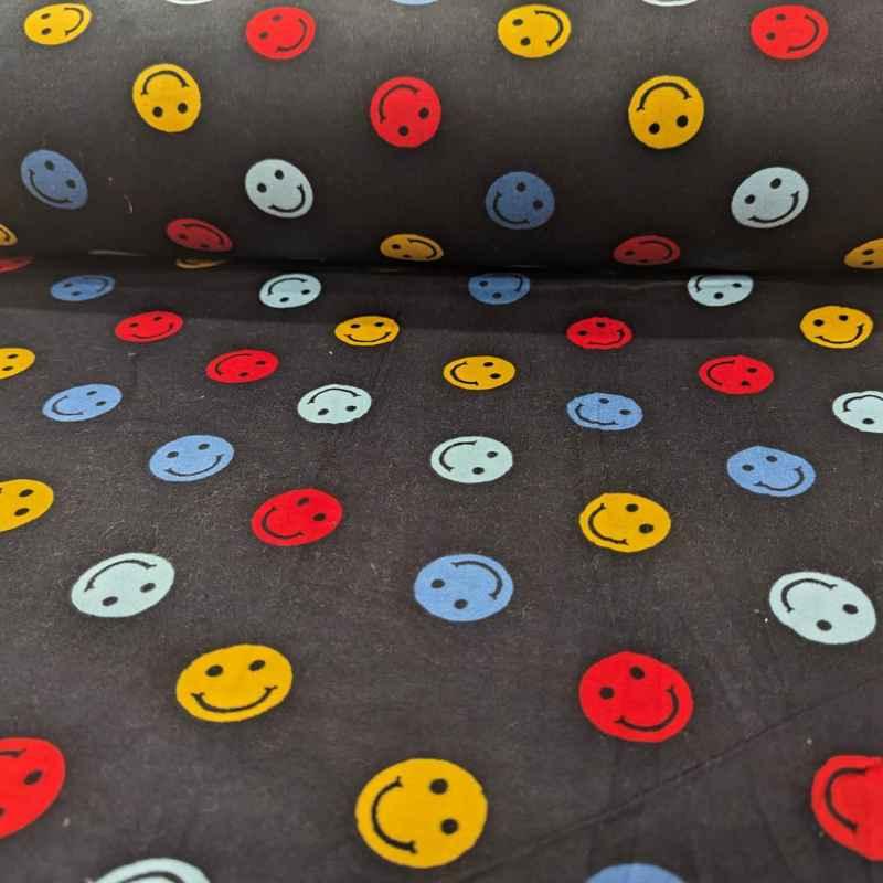 Multi colored Be Happy Face FLANNEL fabric on navy blue