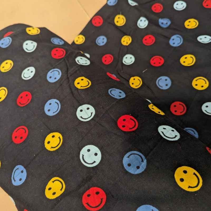 Multi colored Be Happy Face FLANNEL fabric on navy blue