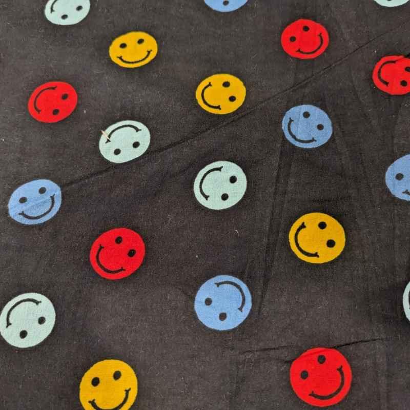 Multi colored Be Happy Face FLANNEL fabric on navy blue
