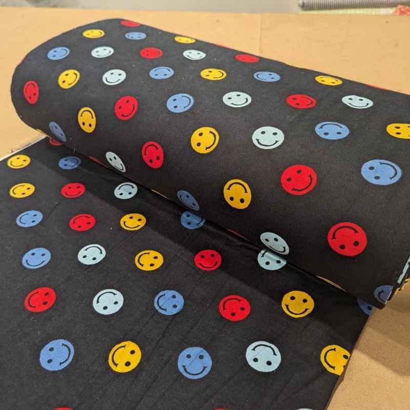 Multi colored Be Happy Face FLANNEL fabric on navy blue