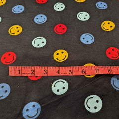 Multi colored Be Happy Face FLANNEL fabric on navy blue