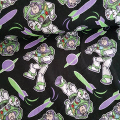 Tossed Buzz Lightyear FLANNEL from Toy Story on Black - Fabric Design Treasures